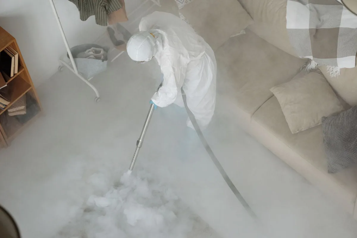 Biohazard cleanup technician in protective equipment, Twin Lakes, CA